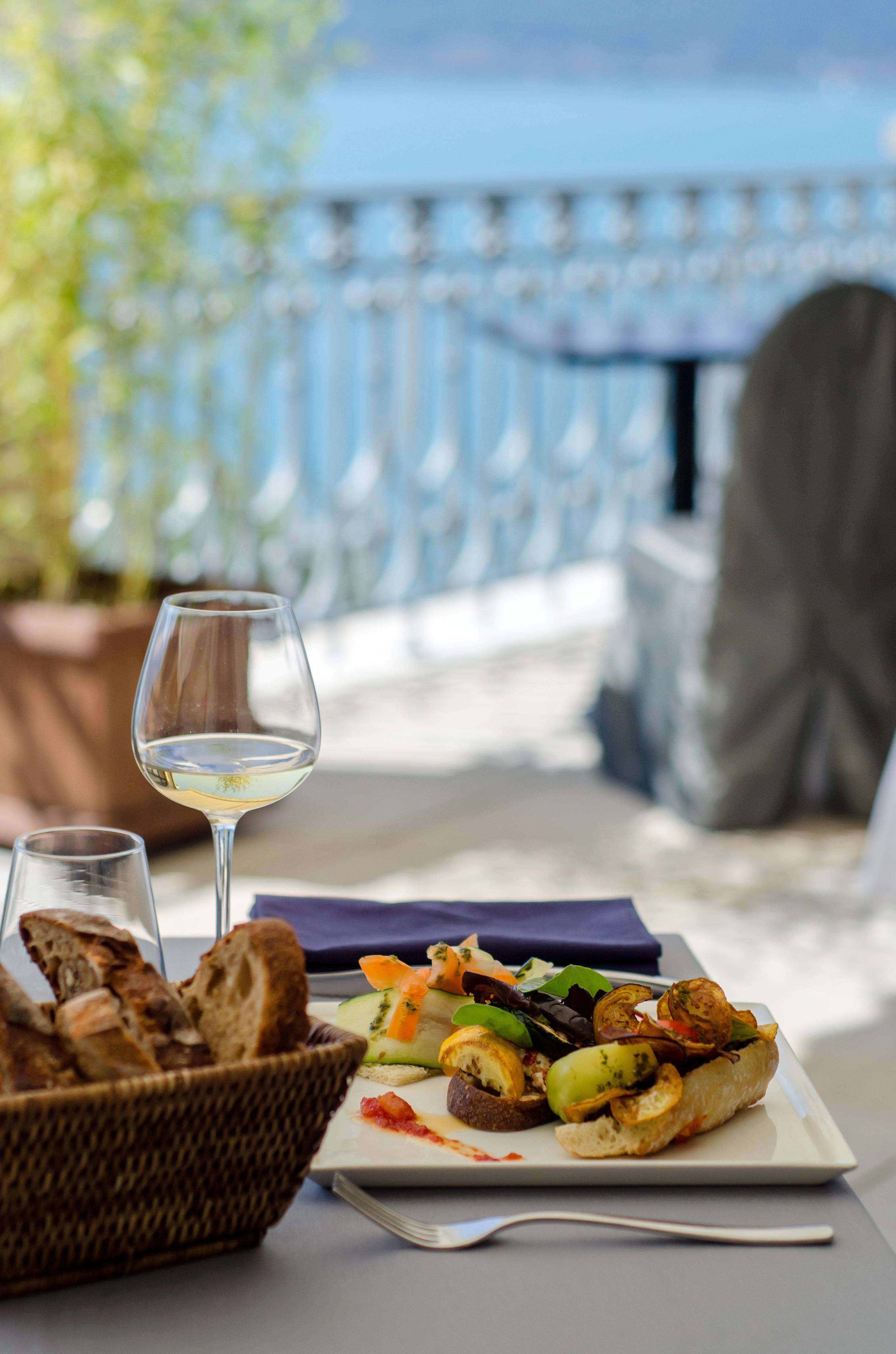 Le Palace De Menthon Exteriér fotografie A glass of white wine